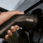 tight shot of plugging in charger into phev